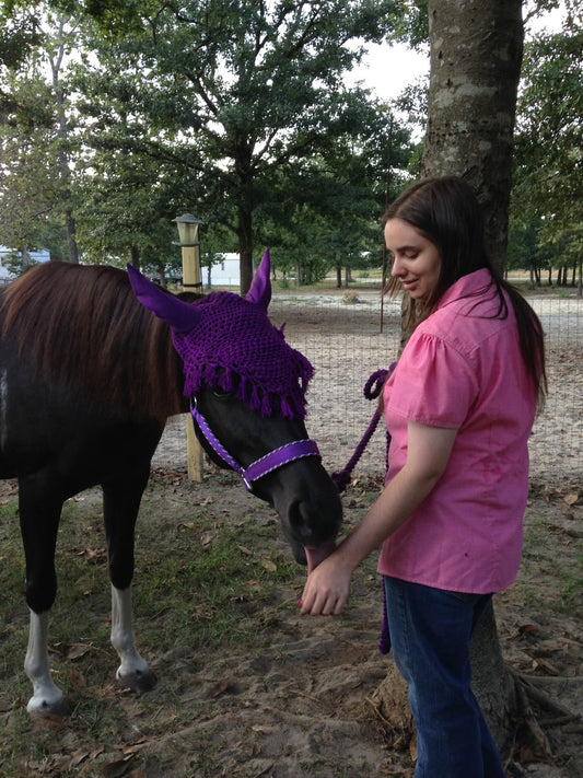Teenage girl and her first horse 